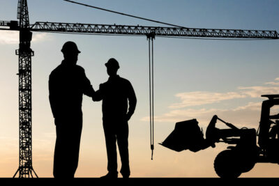 40394331 silhouette of two architect at construction site shaking hand