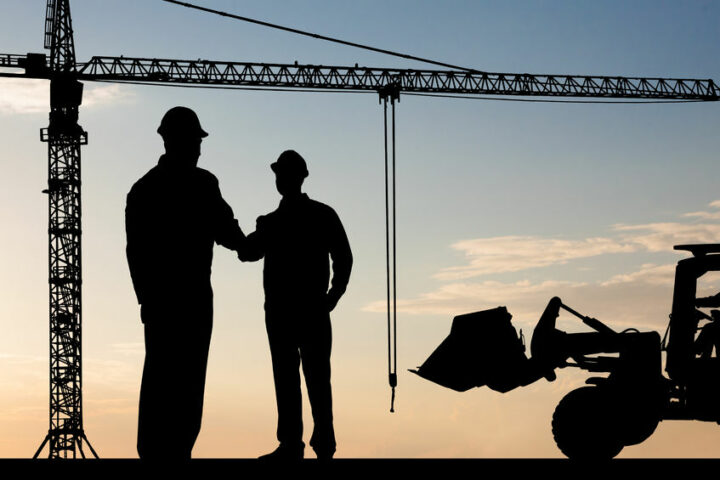 40394331 silhouette of two architect at construction site shaking hand