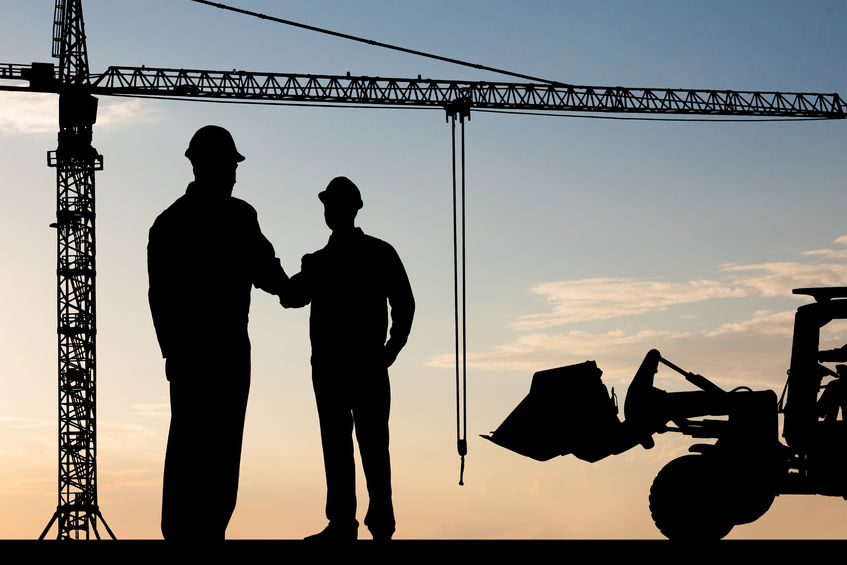 40394331 silhouette of two architect at construction site shaking hand